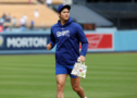 Mar 24, 2024; Los Angeles, California, USA; Los Angeles Dodgers designated hitter Shohei Ohtani (17) on the field prior to the spring training game against the Los Angeles Angels at Dodger Stadium. Mandatory Credit: Kiyoshi Mio-USA TODAY Sports/File Photo